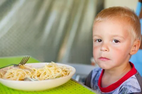 Boy eating spaghetti. Stock Photos