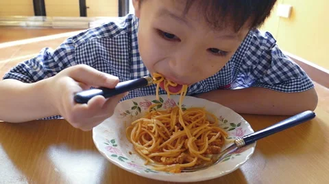 Boy eating spaghetti , Slow motion Stock Footage 53255006