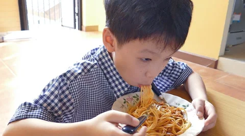 Boy eating spaghetti , Slow motion Video stock 53255207