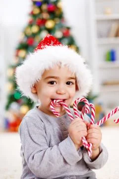 Boy eating twisted candy Stock Photos
