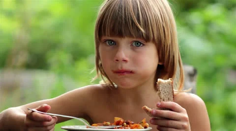 Boy eating vegetables Stock Footage 26301572