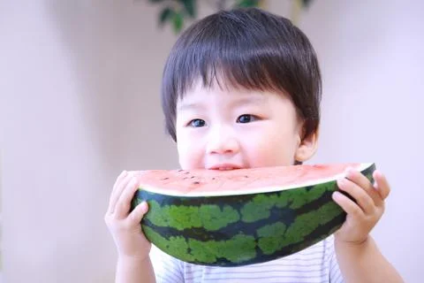 Boy eating watermelon Foto stock