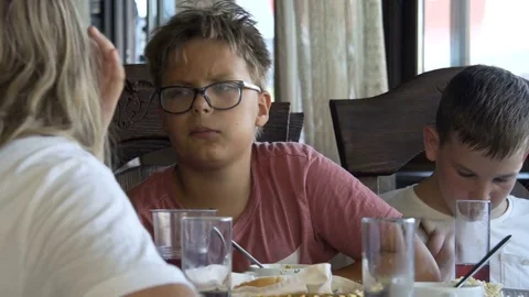 The boy eats and talks with the girl. 10.08.2017. Kyiv. Ukraine. Stock Footage 78775860