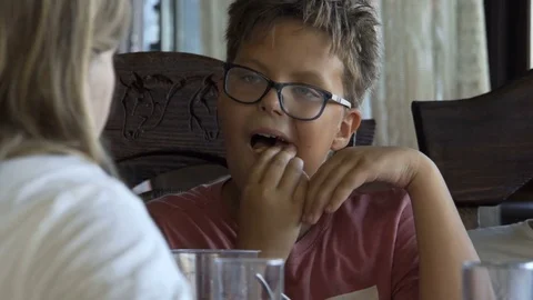 The boy eats and talks with the girl. 10.08.2017. Kyiv. Ukraine. Stock Footage 78775942