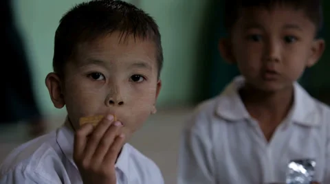 Boy Eats Biscuits provided by World Food Program Video stock 36416688