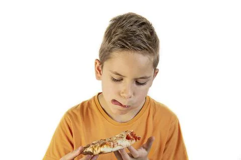 The boy eats delicious pizza on a white background Stock Photos