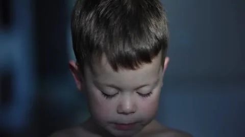 Boy eats his food with spoon carefree innocence and delight of kid-sized meals Video stock 281883959