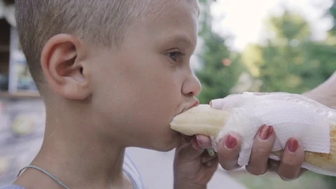 The boy eats hotdog. Stock Footage 94848626