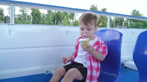 A boy eats ice cream on board Stock-Footage 137598946
