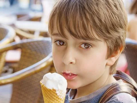 The boy eats ice-cream Stock Photos