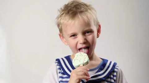 Boy eats ice-cream. stock video Stock Footage 32484165
