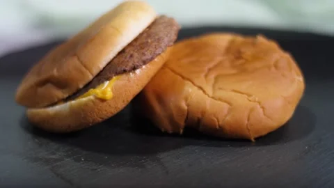 The boy eats a meat cheese burger. Stock Footage 170642551