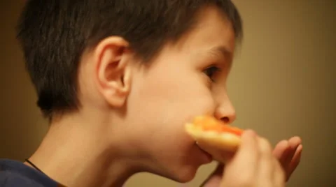 Boy eats a pizza Stock Footage 983028