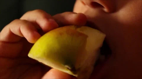 The boy eats tasty apple Video stock 65302178