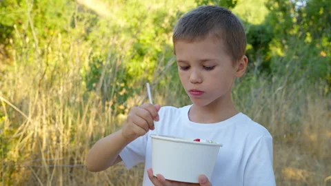 Boy eats a vegetable salad Stock Footage 311995387