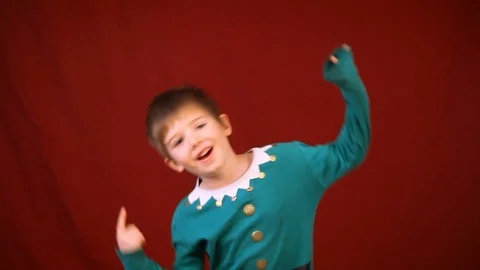 Boy In Elf Shirt Dances A Bit Video stock 116013336