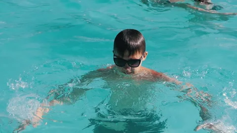 Boy Emerges From Pool Stock Footage 293237377