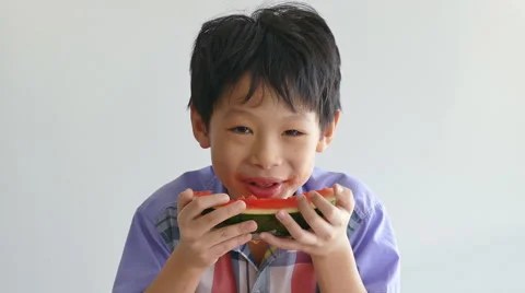 Boy enjoy eating watermelon Stock Footage 56876185