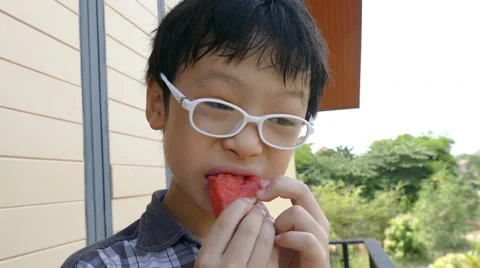 Boy enjoy eating watermelon Stock Footage 64201388