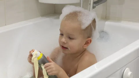 Boy Enjoying a Fun Bath Time Stock Footage 310654983