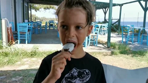 Boy enjoyng eating iceream Stock Footage