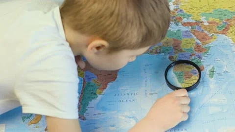 The boy examines the map Stock Footage 151114017