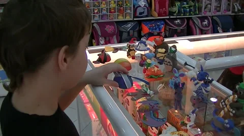 Boy examines toy on the shop window Stock Footage 62474932