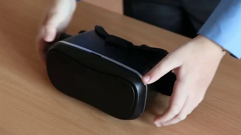 Boy examines virtual reality goggles. hands closeup Stock Footage 71633856