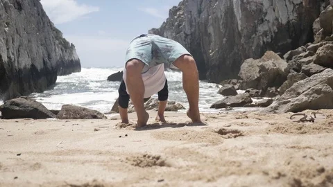 Boy Excercise Hidden Beach Slowmotion 4k Stock Footage 77249586