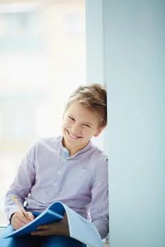 Boy with exercise-book Stock Photos