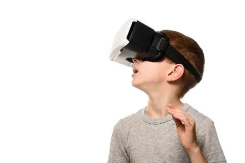 Boy experiencing virtual reality. Portrait. Isolate on white background. Side Stock Photos