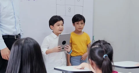 Boy explaining topic to student at classroom. Stock Footage 111196238