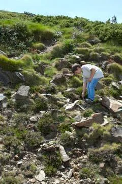 Boy exploring hillside Stock Photos