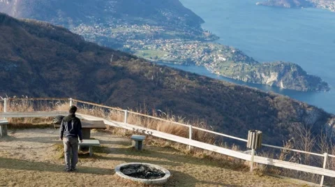 Boy exult with joy when he sees the landscape of the lake Stock Footage 59539072