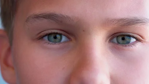 Boy eyes looking directly to camera. Slow motion. 4k video Stock-Footage 132388306