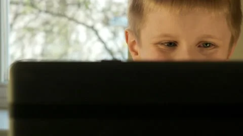 Boy eyes while working on computer close up. Stock Footage 62466315