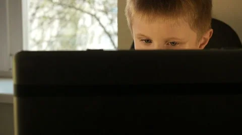 Boy eyes while working on computer close up. Stock Footage 62466594