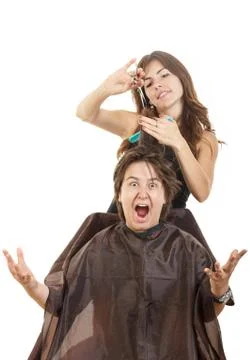 Boy with face expression with long hair at hairdresser Stock Photos