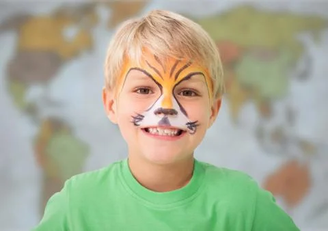 Boy with facepaint against blurry map Stock Photos