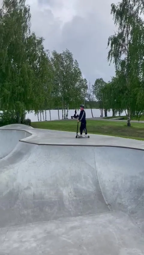 Boy Faceplants While Scootering In Skatepark, Pitea, Sweden - 05 Jun 2025 Stock Footage 311671699
