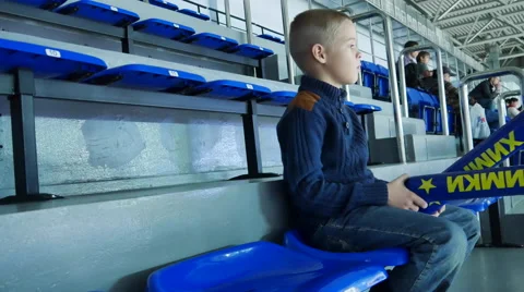 Boy Fan Sits at the Stadium Stock Footage 68368344