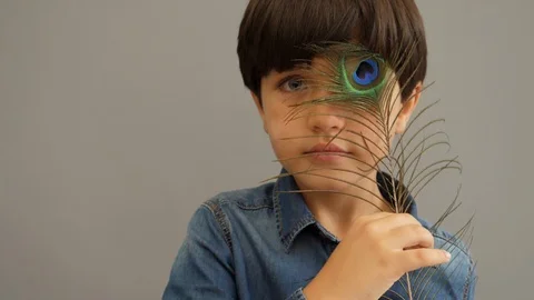 Boy with feather 스톡 동영상 88908652