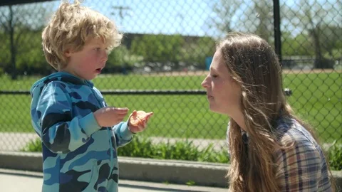 Boy feeds mom mandarin Video stock 75999368