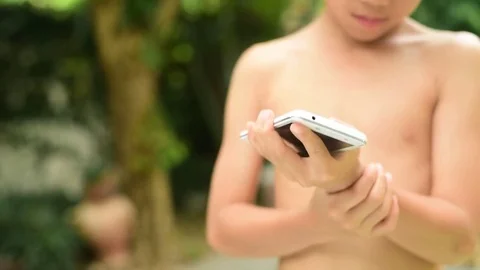 Boy feel pain at hand because smartphone Stock Footage 79021741