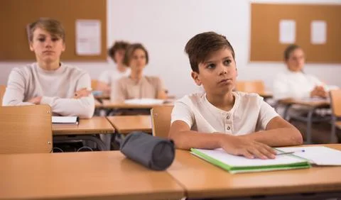Boy feeling upset after getting bad mark at school Stock Photos