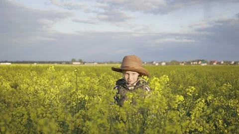 Boy in the field looking at you Stock Footage 130242795