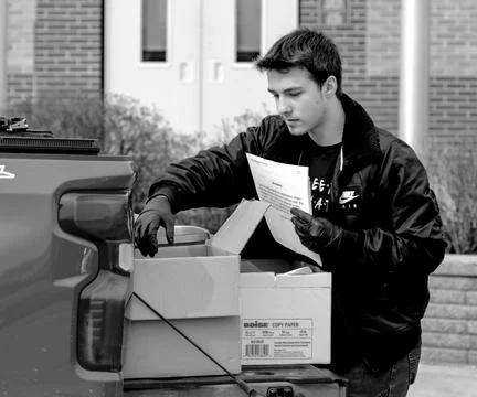 Boy filing papers Stock Photos