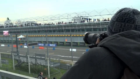 Boy Filming a Race with Camera Video stock 83101240