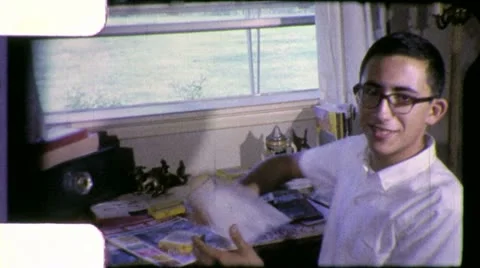 Boy Filmmaker at Editing 8mm Bench Script Film 1960s Vintage Home Movie 4915 Video stock 12335304