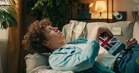 A boy in final year of high school is preparing for exam, studying English Stock Footage 218236099